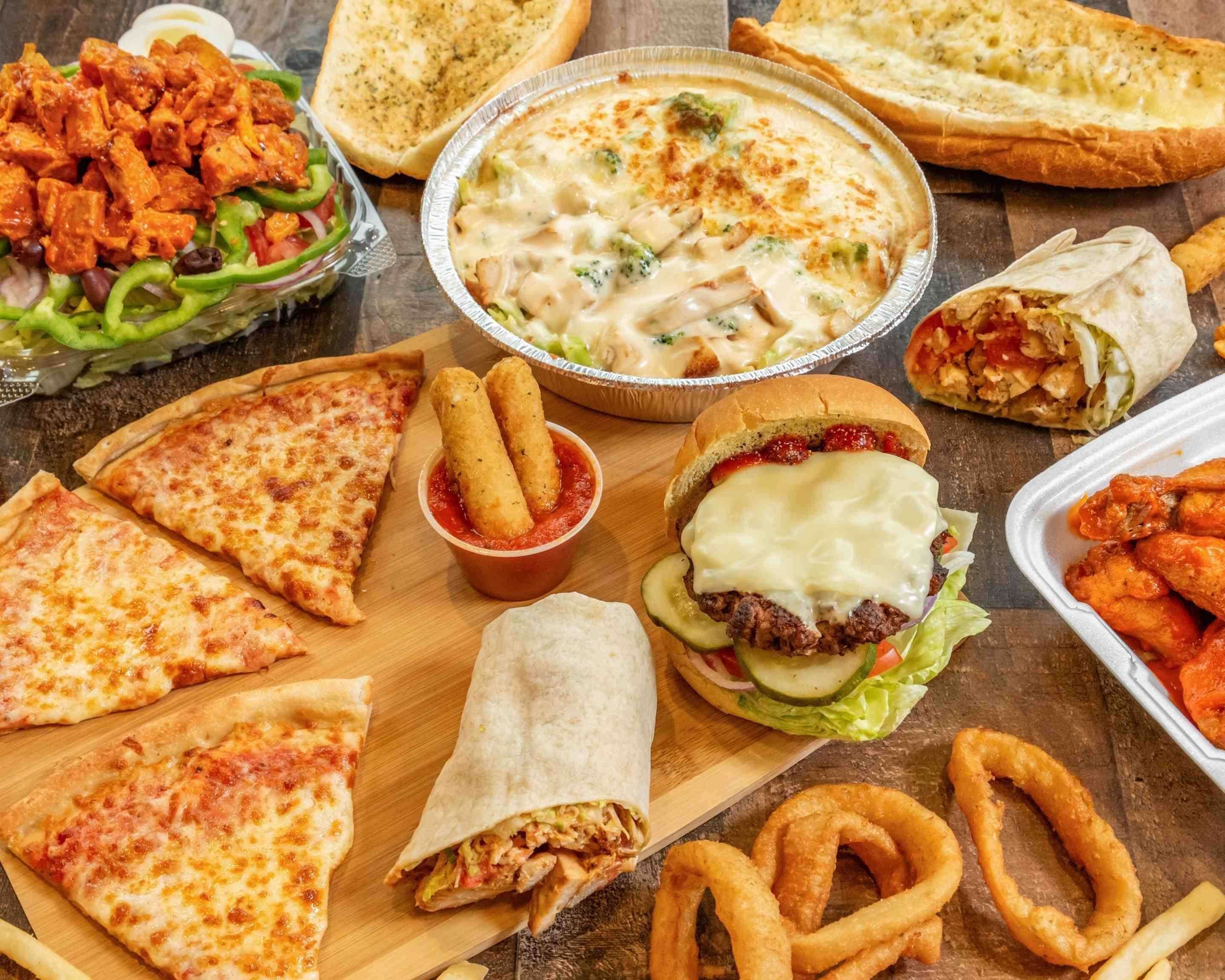 A spread of City View Pizza & Grill menu favorites — pizza, wings, cheeseburger, buffalo chicken wrap, salad, chicken alfredo, garlic bread, mozzarella sticks, onion rings and fries